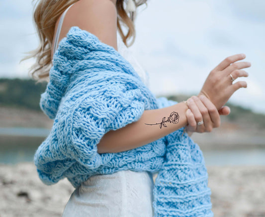 Quelle est la signification des tatouages de rose ?