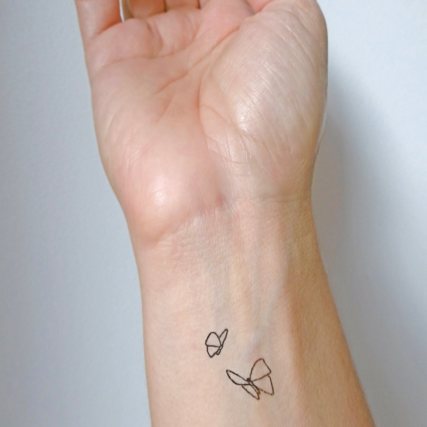 Tatouages temporaires papillons minimalistes (9 sets de 2)